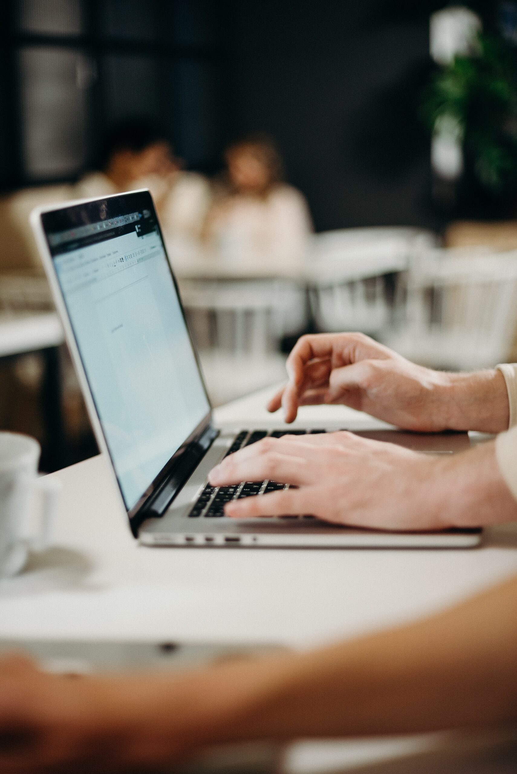 Image of person working on laptop